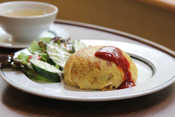 omelette in a white plate on wooden table