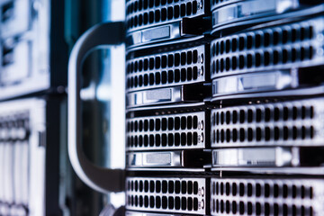 Cluster of data storage hard drives inside server room