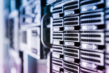 Cluster of data storage hard drives inside server room