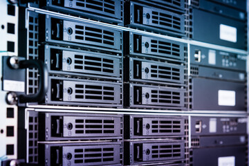 cluster of data storage SSD hard drives inside server rack