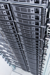 Cluster of data storage hard drives inside server room