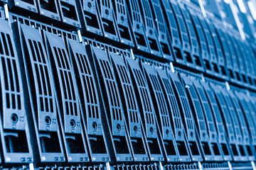 Cluster of data storage hard drives inside server room