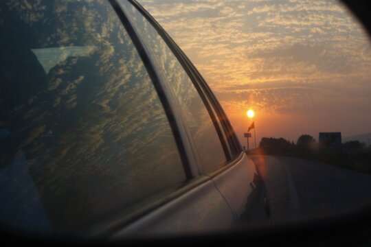 Sun photo from mirror rear. Sun rising photo taken from rear mirror of a car. Turkey