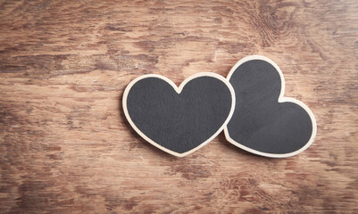Obraz premium Wooden hearts on wooden table.