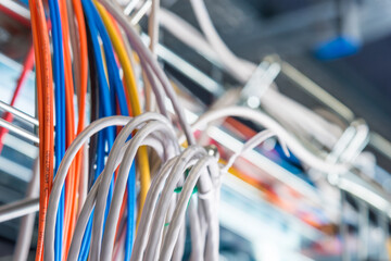 Detail of server room with bunch of fiber optic cables and ether