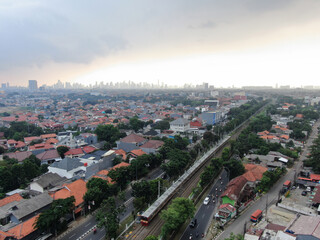 Aerial drone view of KRL commuter line Jabodetabek JR205 electric train near Pasar Minggu, Jakarta,...