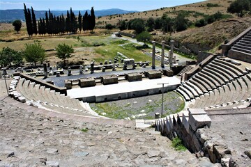 Theatre of The Asclepion of Pergamon Ancient City. Bergama, Izmir, Turkey. Relics, Roman columns, gates during sunny day and blue sky.