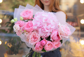 Colorful flowers assorted bouquet in bright paper