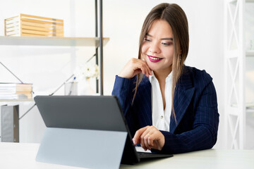 Video conference. Business webinar. Zoom chat. Online corporate meeting. Cheerful confident female leader discussing project strategy with team using laptop in light home office.