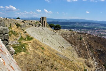 Fototapeta premium Ancient City and Ruins in Izmir during sunny day. Theatre of Dionysus, Pergamon Valley and Pergamon Library. Acropolis ancient city and theater. Izmir, Turkey