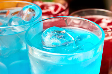 Multicolored alcoholic and non-alcoholic cocktails with ice