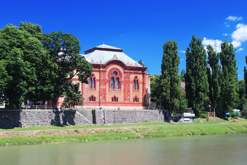 Uzhgorod orthodox synagogue. Facade of a historic building in Uzhhorod, Ukraine. Jewish synagogue made of red bricks on the bank of the river Uzh. Transcarpathian Regional Philharmonic Society.