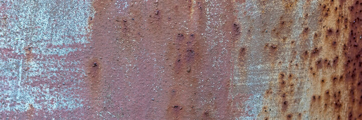 Background of rusty metal texture with traces of corrosion. Panorama.