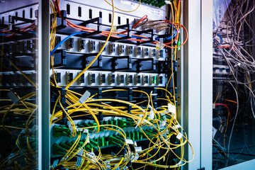 server rack with switch boards and cables