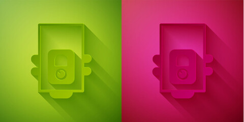 Paper cut Gas boiler with a burning fire icon isolated on green and pink background. Paper art style. Vector.