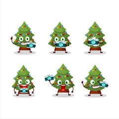 Obraz na płótnie Canvas Photographer profession emoticon with green christmas tree cartoon character