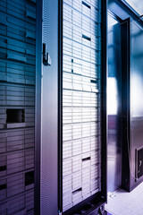 inside data hosting center - serve racks filled with hard drives
