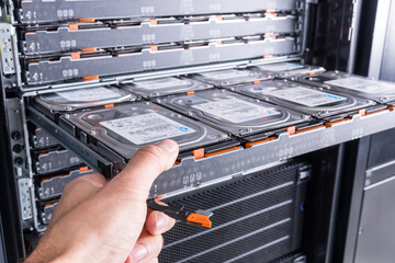 Cloud storage service, engineer pulling out panel and swapping h