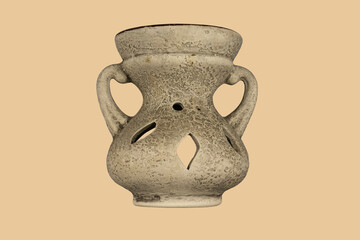 Aromatherapy lamp isolated on a beige background