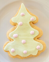 Christmas tree shaped big cookie served on white plate