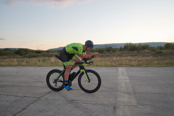 Fototapeta na wymiar triathlon athlete riding a bike