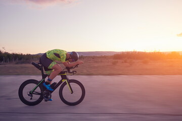 Fototapeta premium triathlon athlete riding a bike