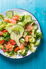 Healthy salad with smoked samlmon and avocado