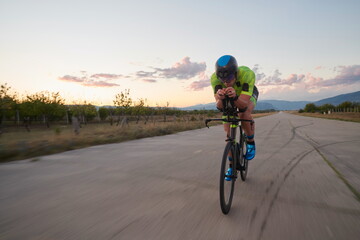 Fototapeta premium triathlon athlete riding a bike