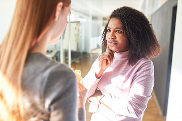 African business woman listens critically