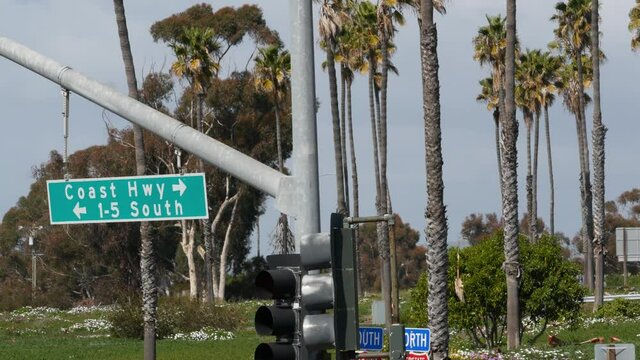 Pacific Coast Highway, historic route 101 road sign, tourist destination in California USA. Lettering on intersection signpost. Symbol of summertime travel along the ocean. All-American scenic hwy.