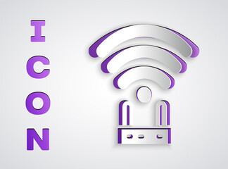 Paper cut Router and wi-fi signal icon isolated on grey background. Wireless ethernet modem router. Computer technology internet. Paper art style. Vector.
