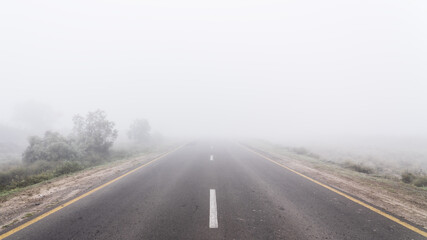 Empty highway road in fog