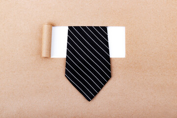 Black tie with torn paper.
