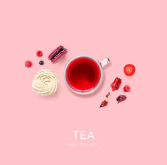 Creative layout made of hibiscus tea, fruits and marshmallow on the pink background. Flat lay. Food concept.