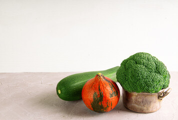 Fresh rbroccol, zucchini and orange pumpkin assortment. Copy space.