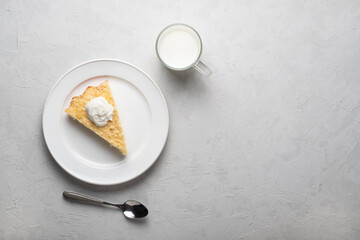 Healthy breakfast made from soft cottage cheese casserole , served with sour cream and  milk.