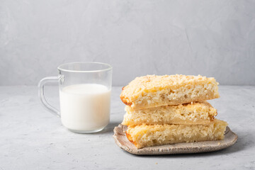 Homemade rustic pie with cottage cheese and milk   on a gray backgroun