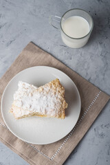 Homemade rustic pie with cottage cheese and milk   on a gray backgroun