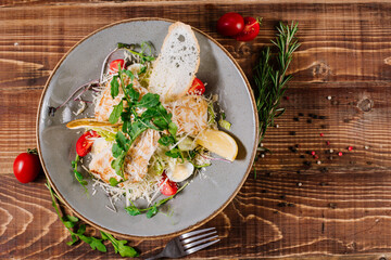 Chicken meat salad with egg, vegetables and herbs
