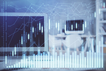 Double exposure of chart and financial info and work space with computer background. Concept of...