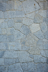 Background texture of a stone wall photo. Natural stone wall texture for the background. Old brick texture, grunge background of a brick wall.