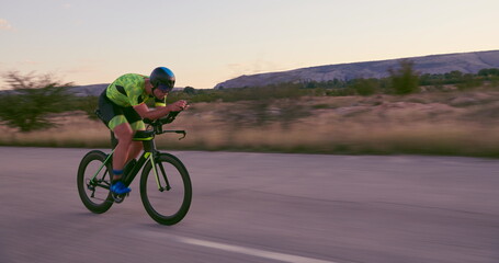 Fototapeta na wymiar triathlon athlete riding a bike