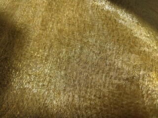 Beautiful gold fabric. Organza in yellow, orange, beige and brown shades. Pleats in the fabric....