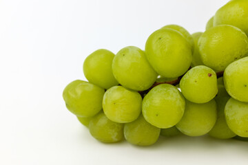 Green grapes on white background