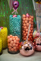 Sweet desserts and other sweets on the decorated table during birthday party