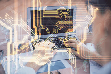 Technology theme hologram with man working on computer on background. High tech concept. Double...