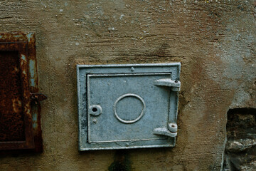 Blue metal door on the wall, Sicily, Erice