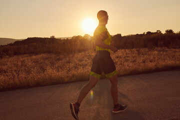triathlon athlete running on morning trainig