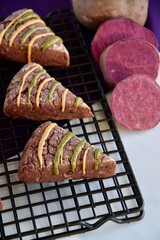 Purple sweet potato scones with peanut butter and pumpkin seed butter on cooling rack
