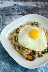 rice noodles with vegetables and sunny side up egg